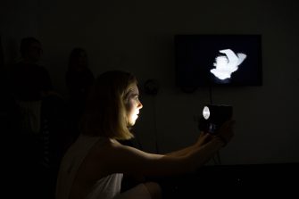 Art and Design Honour student mixed media performance art piece with camera and large screen