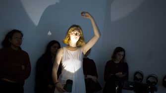 Art and Design Honour student mixed media performance art piece with camera and large screen