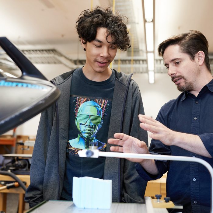 Student working with clay making ceramics