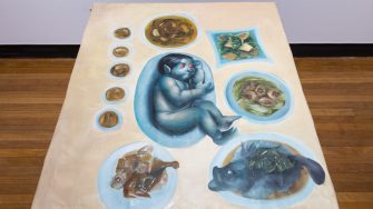 Lok Yin Law, ‘Dinner, in the making’ 2025. Oil on canvas; On table: ‘Just a family reunion’, 134 x 105cm; Wall works: ‘外嫁女 (Married Daughter)’, 40 x 50cm, ‘Wet paint’, 40 x 50cm. 