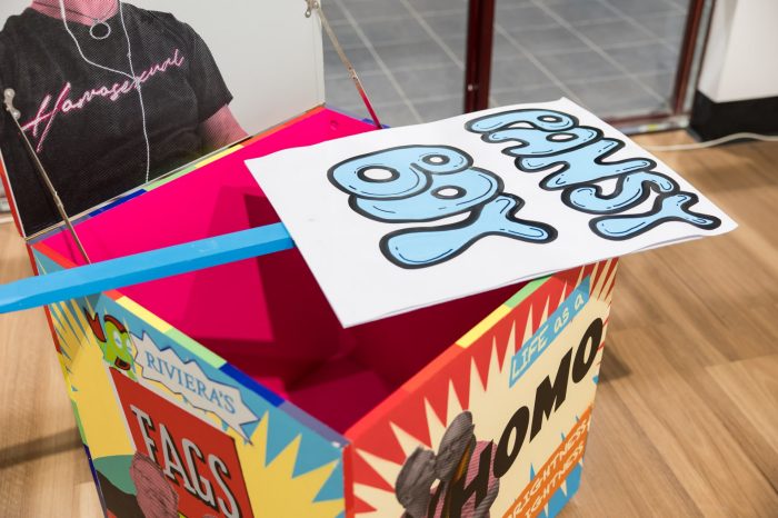 Mark Wilson, ‘I have (something) a lot to say’ 2025. Acrylic screen print and aerosol on wood, paint marker, paper and corflute; Box: 60 x 60 x 60cm each; Pickets: approx. 120 x 55cm each.