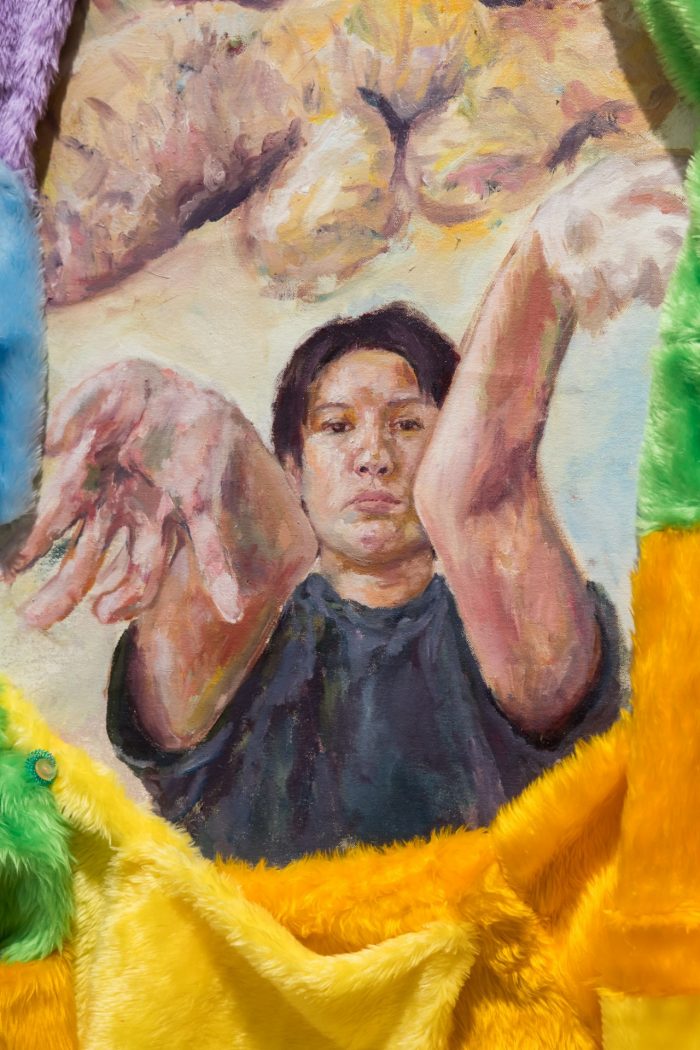 Mei Lin Meyers, ‘Fruit Bag Core’ 2025. Oil on recycled unstretched canvas, plywood, faux fur, paracord, images on printer paper, spray paint, polyester thread, buttons, acupressure ring, metal fixtures, tiger balm, family storage container, recycled calico and polyester fill, op-shop glass bowl; Floor work: approx. 130 x 50 x 15cm; Wall work: approx. 260 x 70cm.