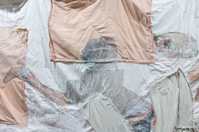 Trinity Johnson, ‘Dreaming of this’ (2025). Found and recycled fabrics and bedding, eucalyptus oil, acrylic medium, thread, beads, earthenware ceramics, 210cm x 165cm. Photograph: Anna Kucera.