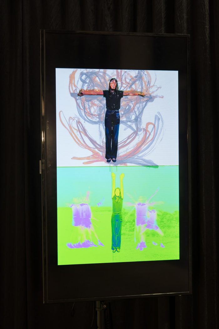 Monica Jie Xu, ‘Body on Repeat: Broadcast Exercise Study’ (2025). Soft-tip colour markers, Chinese black ink, 0.2 mm fineliner pens on 110gsm cartridge paper; mounted on six joined sheets (three A3 and three A4); digital video projection with colour manipulation and motion-trace overlays; bilingual handwritten annotation. Photograph: Anna Kucera.