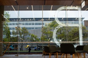 Photograph of the interior of the red centre built environment building located on the UNSW Kensington campus specifically focusing on the 'B' sculpture made of lights