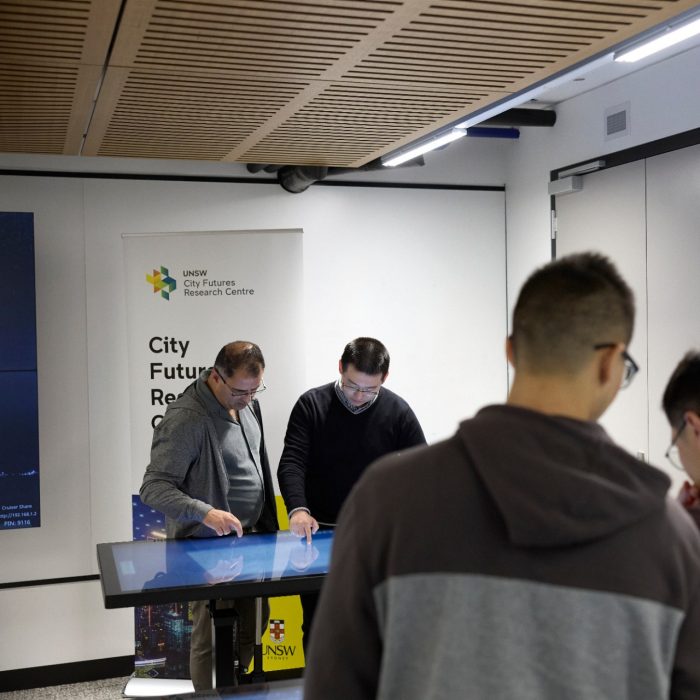 Students using technology in the City Futures Lab at the School of Built Environment