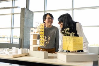 Two people collaborating at a desk