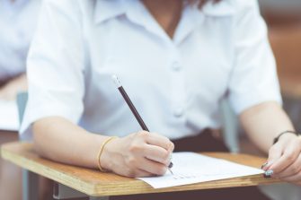 College students taking an exam at school