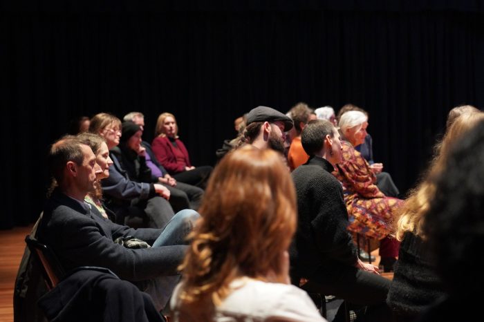 audience at event listening to speaker