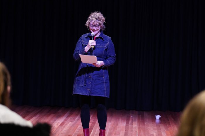 speaker reading at an event