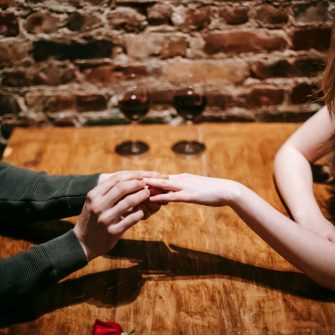 A couple get engaged at a restaurant