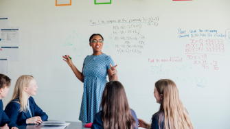 Female teacher discussing STEM: Mathematics during class.