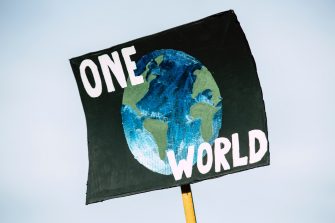 a banner with Earth planer saying one world
