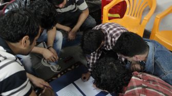 Men working on resource kit matrix