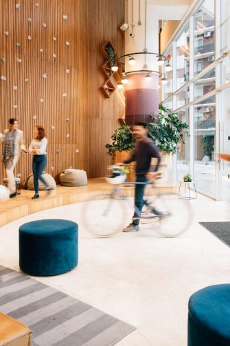 Man working at home is stretching