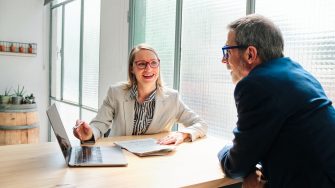 A financial advisor meeting with clients