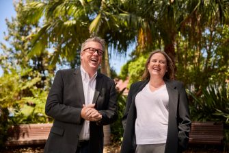AGSM at UNSW students standing together in the gardens on campus