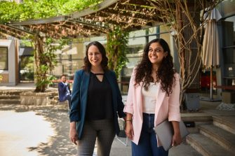 AGSM at UNSW students standing together outside in the courtyard on campus