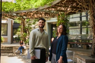 AGSM students working together outside in the courtyard setting on campus