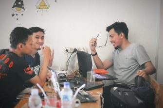 Three people smiling