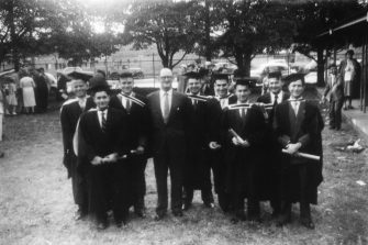 Langer Edward and his commerce cohort with professor E. B. Smyth 1959 graduation ceremony