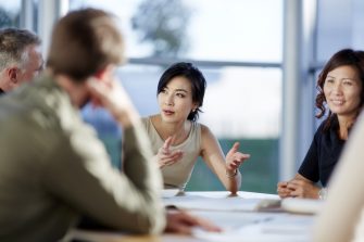 Business people talking in meeting - stock photo