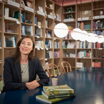 Business School Social Impact postgraduate student in café