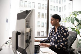 Women using desktop computer