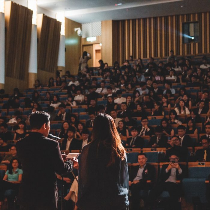Man giving a speech at an award ceremony
