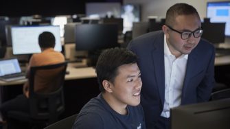 Men looking at screen
