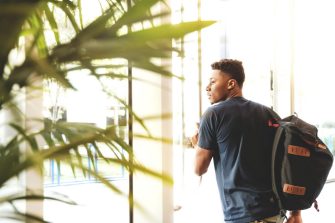 Student going through glass doors