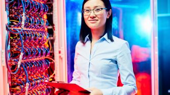 A woman standing next to wires