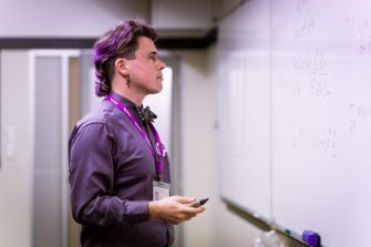 A person standing at whiteboard