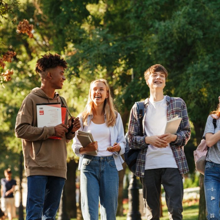 A group of students chatting and walking