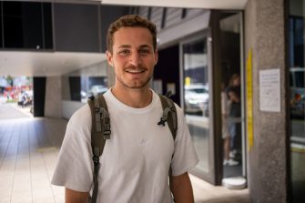 A student  outside a building on UNSW Kensington Campus