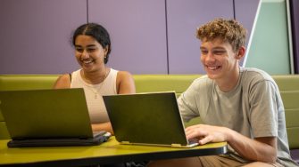 A group of students using laptops while studying indoors on UNSW Kensington Campus