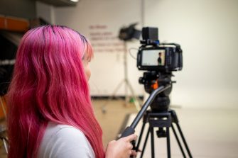 Two students working in a photography studio on Paddington Campus