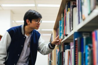 Students browsing books in the main library