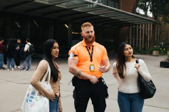 People in conversation on campus