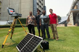 Group of men with scientific equipment 