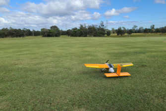 AIAA Design Build Fly image of a plane in an open field