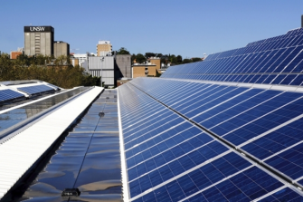 Martin and Judy Green in London, Martin holding the Faraday Medal