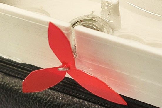 Liquid metal droplet rotary paddle motor