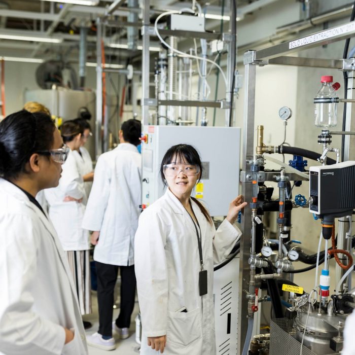 Students working on high tech lab equipment