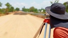 Surveyor on road