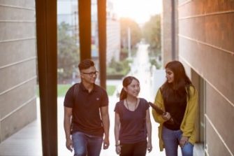 Three students walking