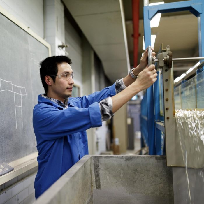 Man working beside chalkboard