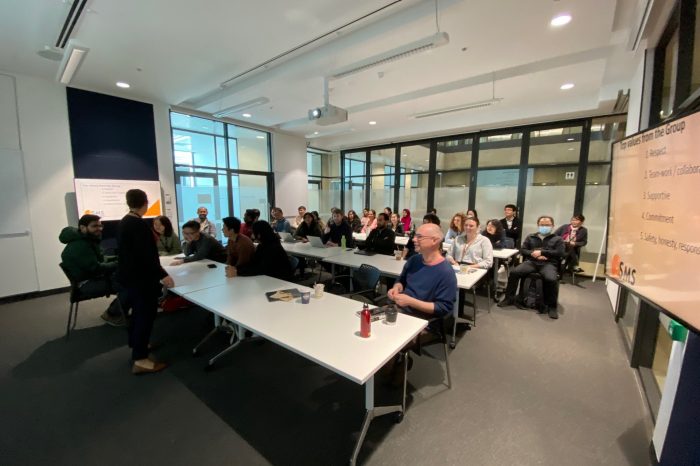 Photo of room with team