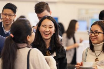 Alumni talking at an event
