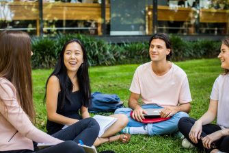 UNSW students sitting outdoors